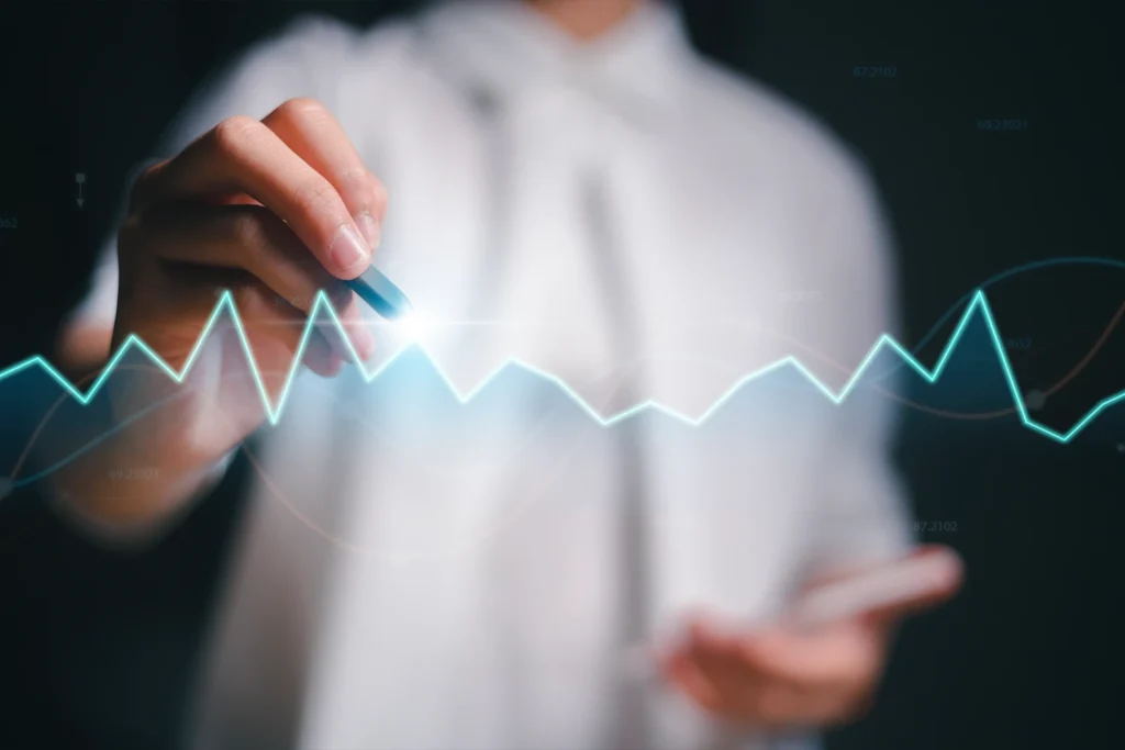 Manager analysiert Wirtschaftsdaten und Konjunkturverlauf 2025 auf digitalem Chart – Symbolbild für wirtschaftliche Entwicklung und Unternehmensstrategie in Deutschland.